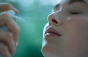 Woman hydrating her skin.