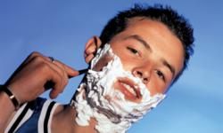 Boy shaving. 