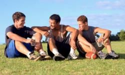 Teenage boys on football field. 