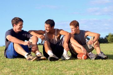 Teenage boys on football field. 