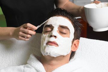 Woman applying skin treatment.