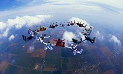 Skydiving Image Gallery Skydivers in formation over Hawaii. See more pictures of skydiving.