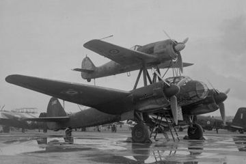 October 1945: An obsolete Junkers JU 88 transport plane with a Focke-Wulf FW 190 fighter on top, at a display of British and German aircraft at the Royal Aircraft Establishment in Farnborough, England.