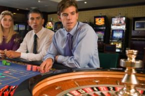 gamblers at roulette wheel