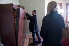 Rep.-elect Joaquin Castro, D-Texas, checks out a Murphy bed while apartment hunting on Capitol Hill.