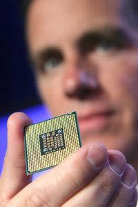 Intel vice president Tom Kilroy holds a Dual-Core Xeon Processor 5100 at a press event in San Francisco.
