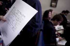 A reporter holds a copy of President Barack Obama's long form birth certificate in the briefing room of the White House in 2011.  Obama released this after extended criticism by those who do not believe he was born in the United States