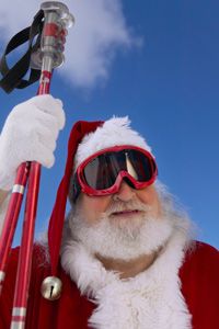 Santa Claus with ski equipment