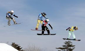 Lindsey Jacobellis, Sandra Frei, Olivia Nobs and Tanja Frieden fly through the air in the 2008 FIS World Cup.