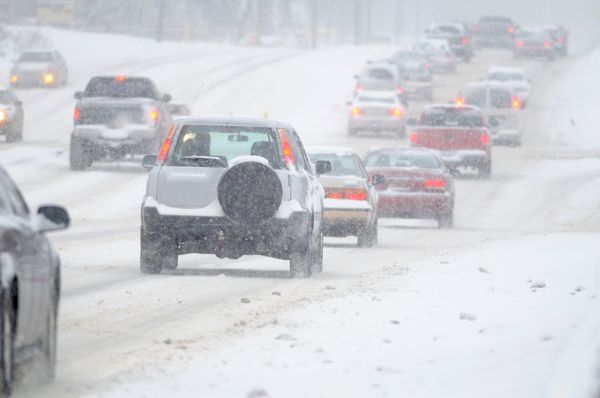 Speeding car in winter snow traffic.