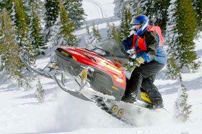 Person speeding through snow in extreme outdoors sports.