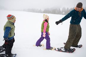 Boys playing in winter snow outdoors.