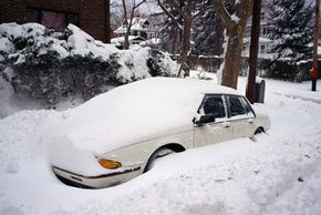 Digging out your buried car is a tiresome task -- why not stay inside and drink?