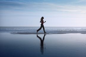 Running close to the shore, where the sand is damp, can give you a good workout.