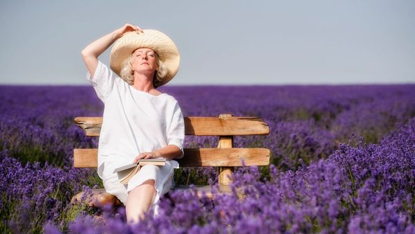 smelling lavender in field