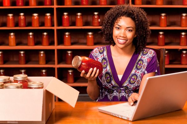 woman with jar of sauce