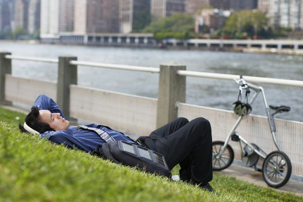 Outdoors: Businessman, alone.