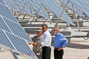 President Barack Obama, Senate Majority Leader Harry Reid of Nevada, and Col. Howard Belote, checked out the solar panels at Nellis Air Force Base in Nevada in May of 2009.