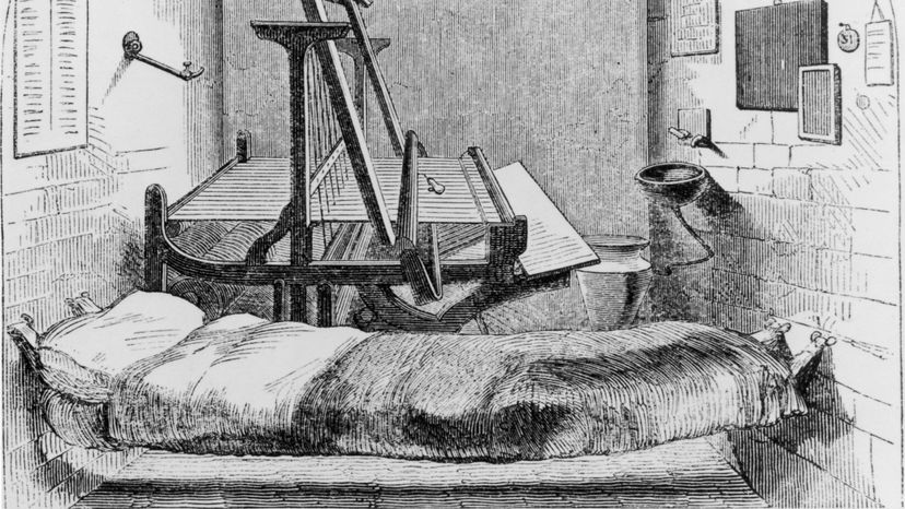 An early example of solitary confinement: a single cell, furnished with a suspended bed and a loom for day work, in Pentonville Prison, London, 1850. Hulton Archive/Getty Images
