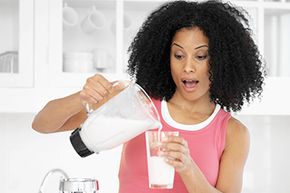 woman pouring milkshake