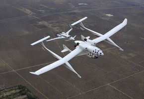 The White Knight launch aircraft carries the spaceship (followed by Bob Scherer's Starship chase aircraft).