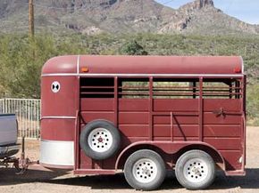 This horse trailer boasts a spare tire mount rack.