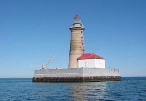 The Spectacle Reef lighthouse stands 95 feet tall and is located on a submerged reef about 11 miles east of the Straits of Lake Huron. See more lighthouse pictures.