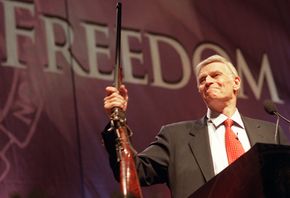 National Rifle Association president Charlton Heston at the special interest group's 2002 convention.