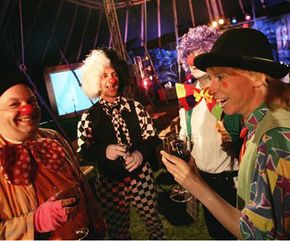 British clowns in full costume enjoy a drink as they gather for a speed-dating event at a circus in northern London.