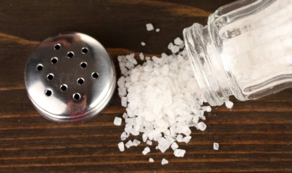 Spilled salt on a table.