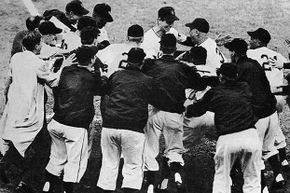 Bobby Thomson (center top) is mobbed by happy teammates after he hit the 'shot heard 'round the world' home run which won the game and the National League pennant for the New York Giants over the Brooklyn Dodgers  in 1951.