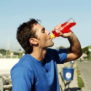 guy drinking sports drinks