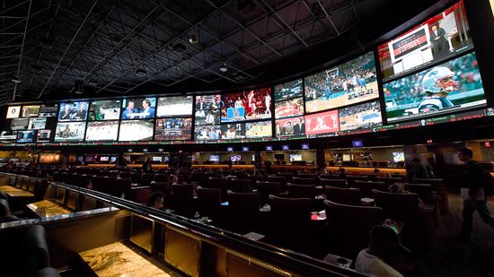 美国各州争相把体育投注”class=