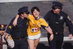 Rosie Ruiz shown moments after crossing the finish line as the apparent women's race winner of the 84th Boston Marathon in 1980.  But not for long.