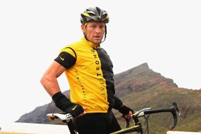 Lance Armstrong takes a stop during a training ride back in 2008. Will he continue wearing the Livestrong shirt now that he's off the board of the foundation that he created?