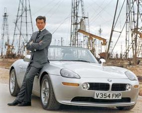 Pierce Brosnan as Bond, with his BMW Z8 from "The World is Not Enough."”border=