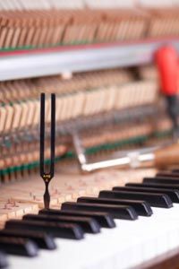 Tuning fork on piano keys