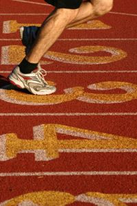 Athlete sprinting on sports track.