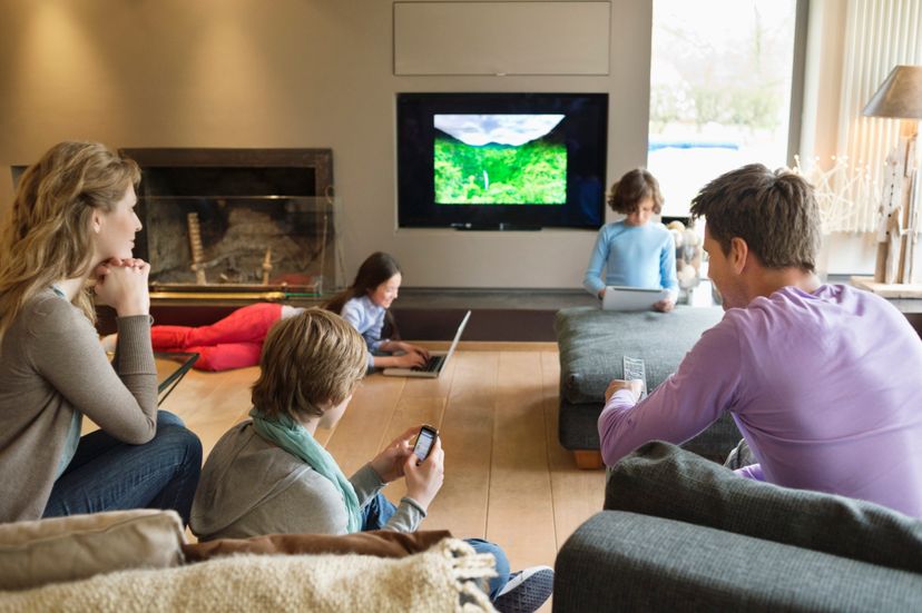 family using electronic gadgets