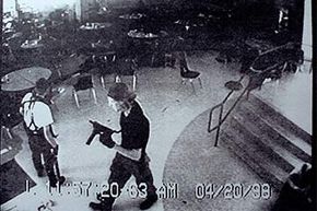 Columbine High School shooters Eric Harris (L) and Dylan Klebold appear in this video-capture of a surveillance tape in the cafeteria of Columbine High. The school shooting has been cited as 'inspiration' for copycat criminals.