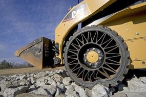 Construction vehicle using the Tweel Airless Tire.