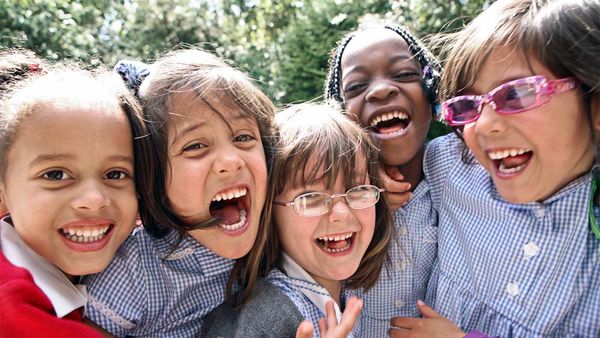 Cheerful child smiling in outdoor happiness.