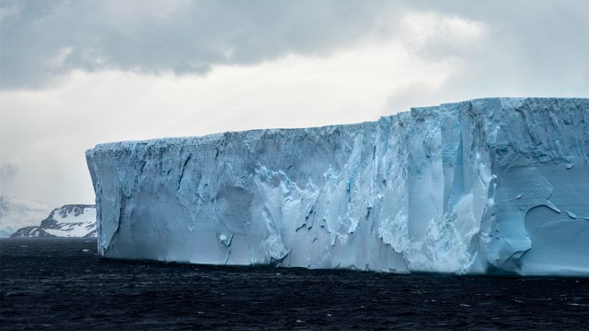 A tabular iceberg floats off the coast of Antarctica. Researchers are monitoring the massive iceberg A-38 (significantly larger than the one pictured here) to see whether it breaks up and how it affects shipping lanes. Ignacio Palacios/Getty Images