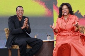 Rapper Jay-Z and TV personality Oprah Winfrey applaud during the first taping of the 'Oprah Winfrey Show' at the Sydney Opera House on December 14, 2010 in Sydney, Australia.