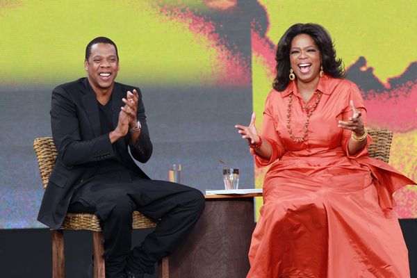 Rapper Jay-Z and TV personality Oprah Winfrey applaud during the first taping of the 'Oprah Winfrey Show' at the Sydney Opera House on December 14, 2010 in Sydney, Australia.