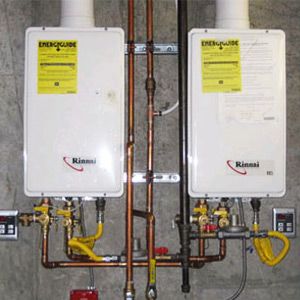 These two tankless water heaters are set up in parallel for extra heating power.Â­