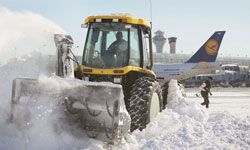 snow ploughs cleaning up airport