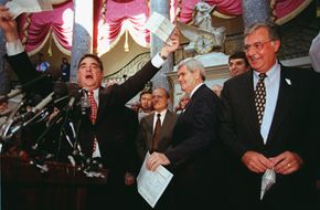 Billy Tauzin, R-La. (left) and House Majority Leader Dick Armey, R-Texas (right) express their feelings toward the tax system during a National Tax Reform Debate Tour in October 2007.