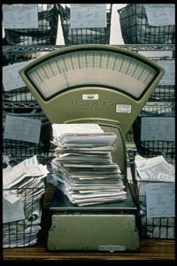 Forms 1040 pile high on a scale at a Philadelphia IRS processing office in 1998.