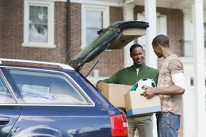 single dad loading car for college